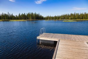 Floating swimming raft dock on a forest lake